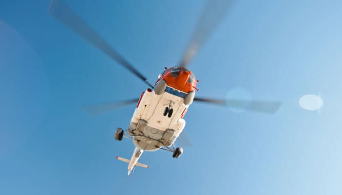 Flying helicopter near an oil platform