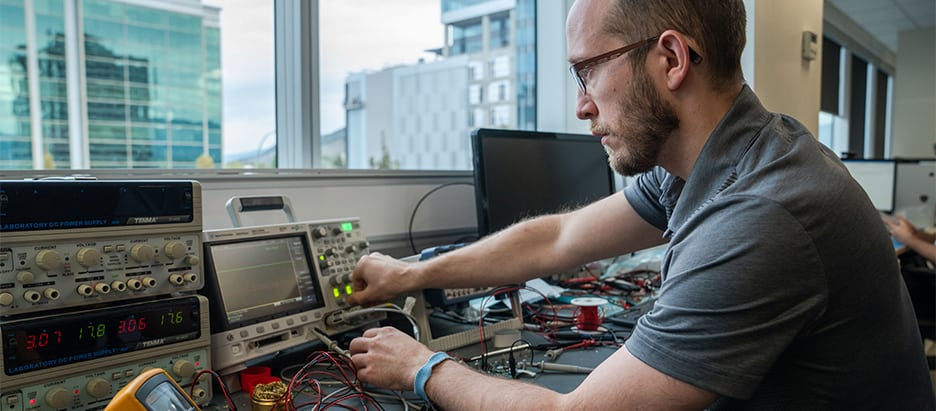 skytrac employee works on engineering hardware