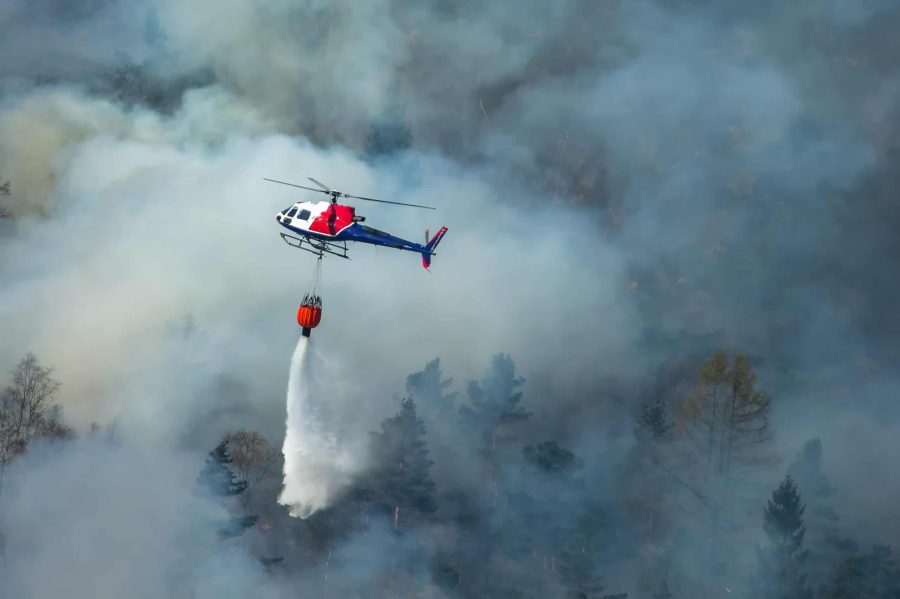 Helicopter extinguishing wildfire.