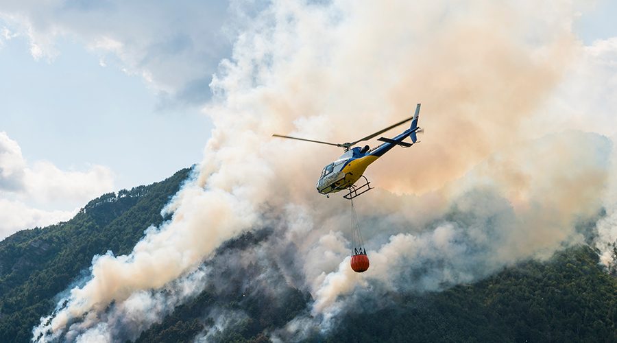 Aerial-Firefighting-with-helicopter-on-a-big-wildfire-in-a-pine-forest